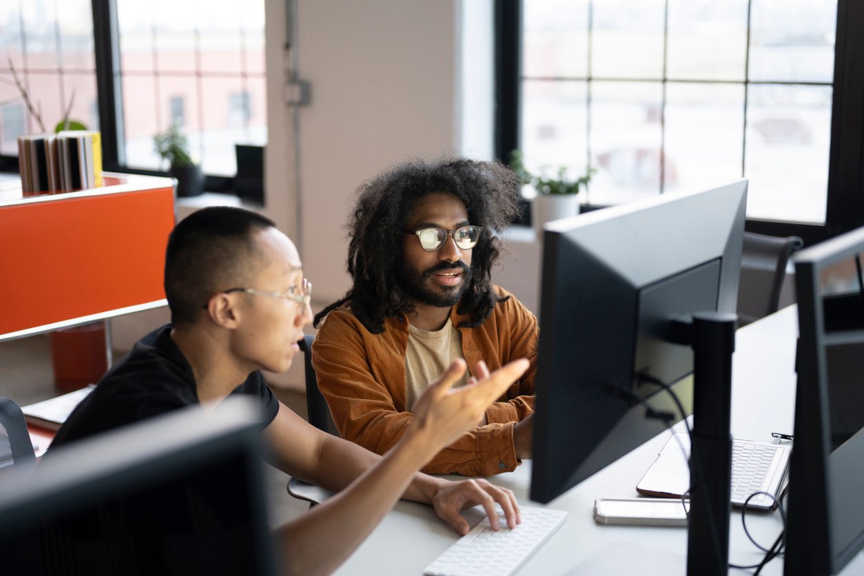 Men working on a computer